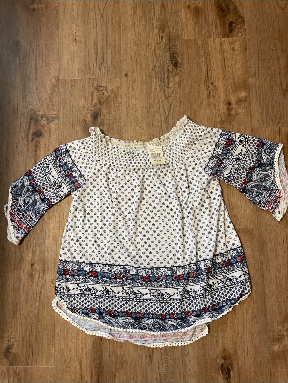 Crave Fame White Smocked Off-Shoulder Top with Navy Floral Print